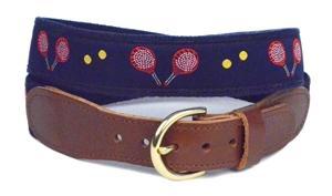Men's Pickleball belt has red racquets with yellow balls on a navy ribbon background. It is finished on navy cotton  webbing Leather tabs and brass buckle sizes 30 54  