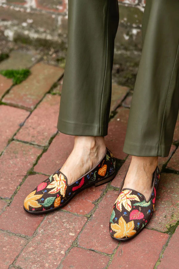 Multi fall colors in a fall pattern of Fall favorites on chocolate brown background. Perfect transion shoe as the temps change
