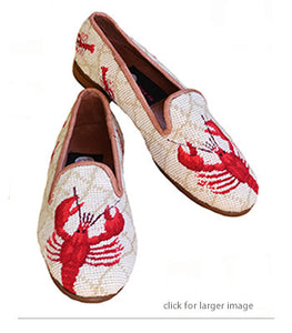 Misses hand stitched needlepoint loafer is such a classic with red l obsters hand sewn on  an oatmeal  background surrounded by baby lobsters in their red outfit along the back. It has a leather lining and piping
