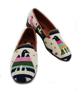 The  Aztec  bird symbol is colored in pinks green, light blue shades resting on an ivory background. Perfect shoe to add color to your outfit. Shoe  has leather piping around the shell and is leather lined.