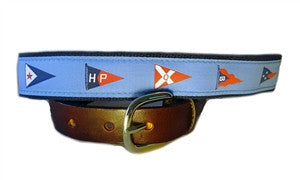 Boy's Burgee Ribbon Belt represents the colorful red, white and navy colored flags flown at the yacht clubs                                      s of Cape cod and the Vineyard. The belt is designed a medium blus ribbnon background with navy webbing and finished withe navy webbing, brass buckle and leathern tabs.