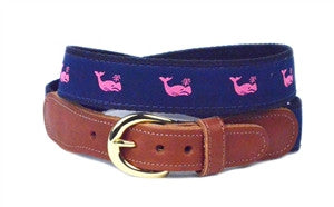                                                                                                                                                Our Pink preppy ribbon belt  is mworn by everyone from the Star on New  Girls to my  Uber driver. The pink whales are woven into navy ribbon and stitched onto the navy webbing. The belt I is finished with a brass buckle and leather tabs.