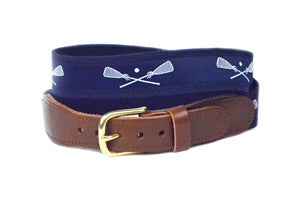 popular lacrosse belt on a navy background with white lacrosse sticks crossed 