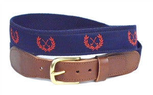 Boys Custom Canvas ribbon golf belt, known as Tee Time, is a Lillie Designs Exclusive. It is created with red crossed clubs in a wreath background on navy ribbon This favorite is finished on navy webbing with fine leather tabs and a brass buckle.