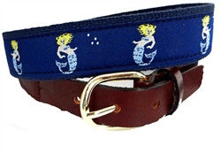 The little Marmande colored in shades of blue  and flowing blonde hair is enjoying her swim in an under water scene designed on a navy ribbon background on navy wbbing. It is finished with a brass buckle and leather tabs. 