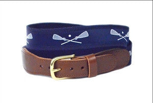 Boy's exclusive navy and white Lacrosse ribbon belt  is finished on navy webbing with a brass buckle and leather tabs.