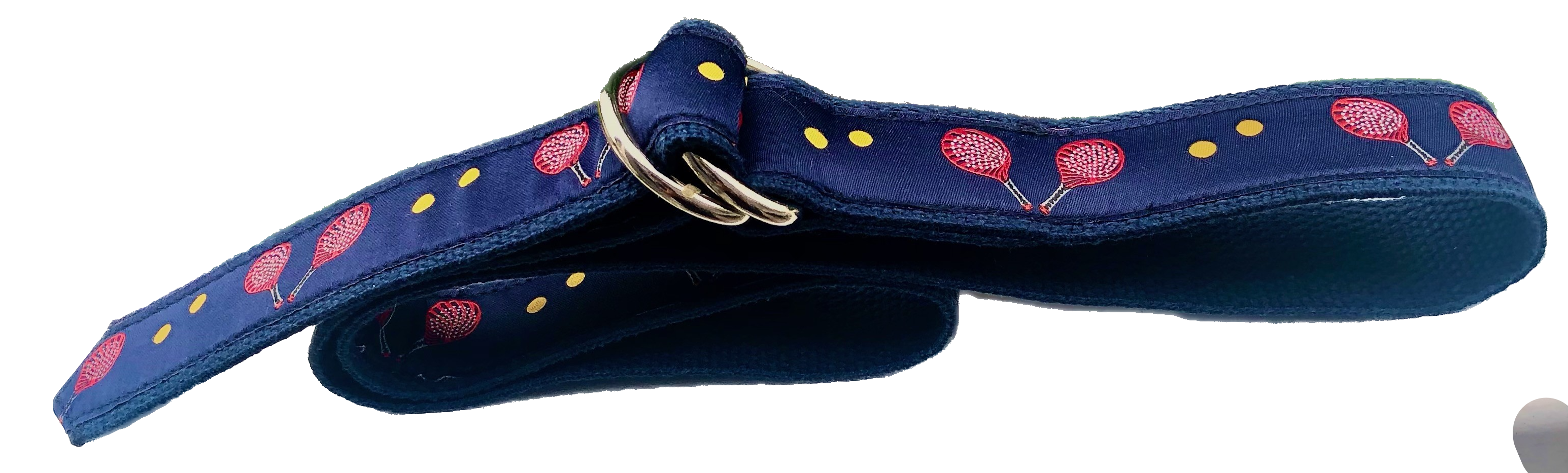  Adult's Pickelball belt has two colorful red racquets surrounded by yellow balls. It is stitched by hand with D-rings on navy cotton webbing. Size: XXS-XXLarge           