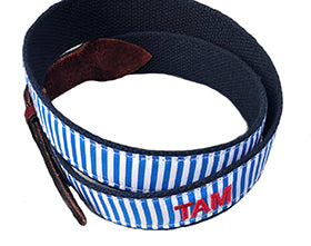 Hands0ome light blue and white stipe monogrammed belt with red thread lettering. Select your font, thread color, and insert the initials, we will do the rest. to create a great gift.
