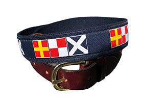 Men's popular nautical flag belt  in multi colors spells rum. It is finished with navy cotton webbing, brass buckle and loeather tabs. Size: 30-54 A Lillie Exclusive.