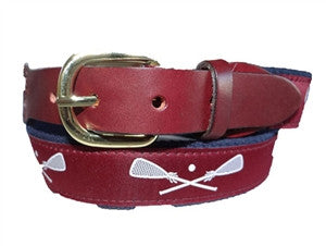 Men's custom Canvas Maroon lacrosse belt is a Design by Lillie Exclusive. The pattern is a prep schoo favorite with white sticks on a woven  maroon ribbon and completed on maroon webbing, leather tabs and a brass buckle.